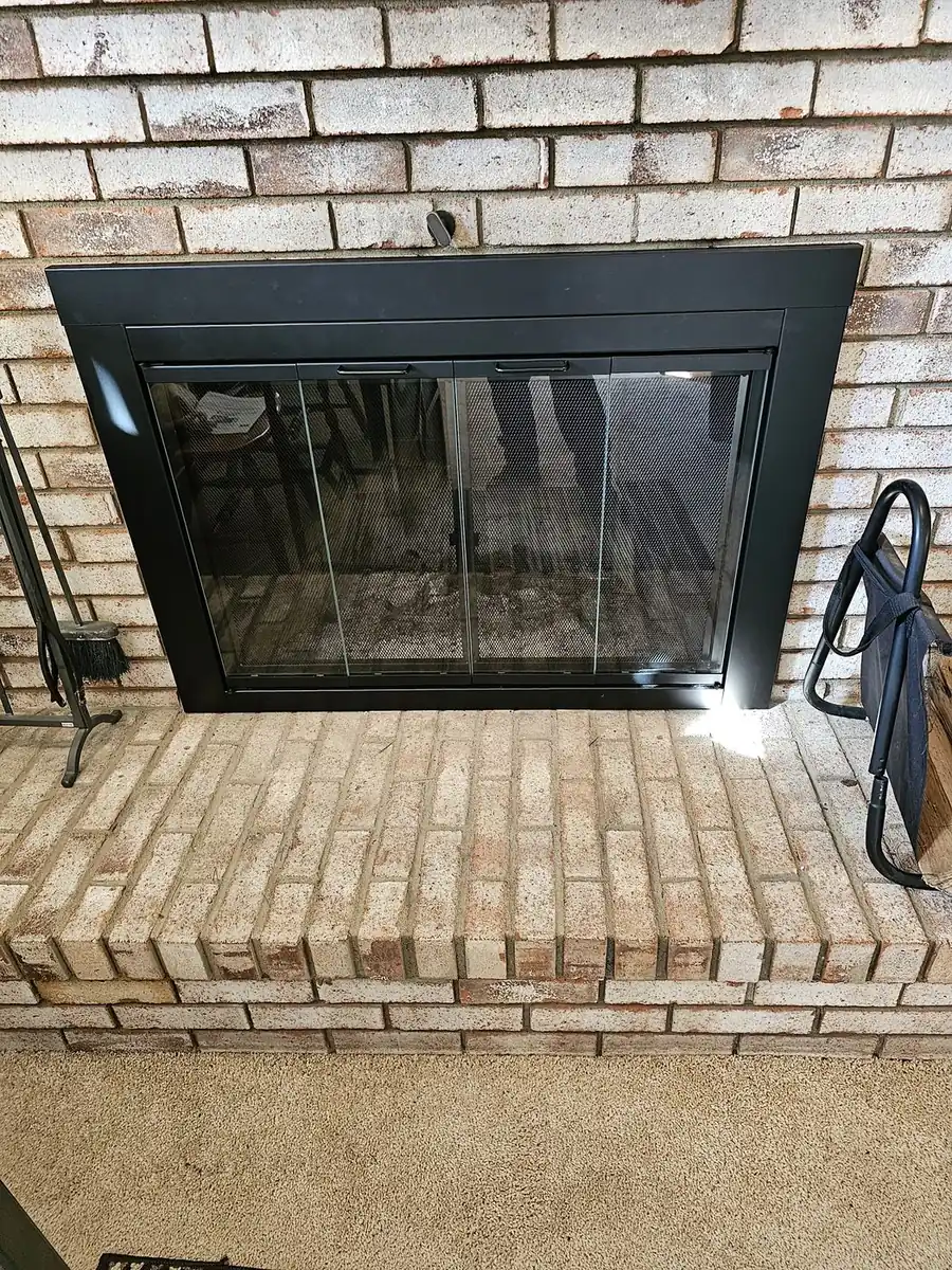 Green and Clean technician inspecting a fireplace